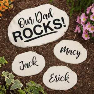 FATHER'S DAY GIFT GUIDE. IMAGE OF GARDEN ROCKS THAT SAY "OUR DAD ROCKS' PLUS INDIVIDUAL ROCKS WITH KID NAMES