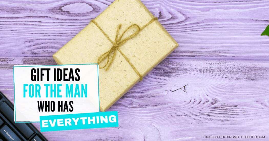 Gift Ideas for the man who has everything and is impossible to shop for. Blog image with a generic wrapped present.