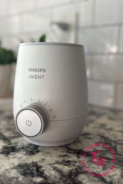 Best Bottle Warmer for your baby. picured Avent bottle warmer on kitchen counter.