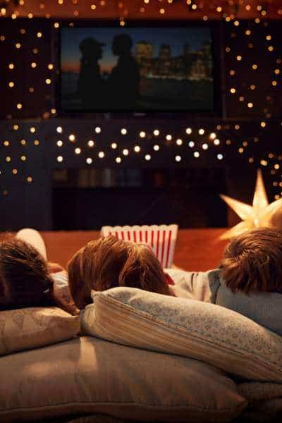 pick of family watching a movie together.