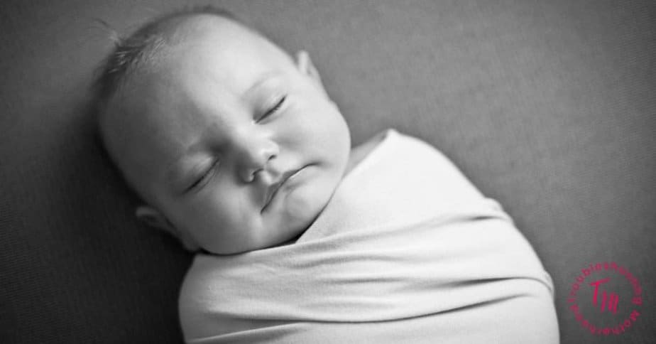 baby in a swaddle, sleeping.