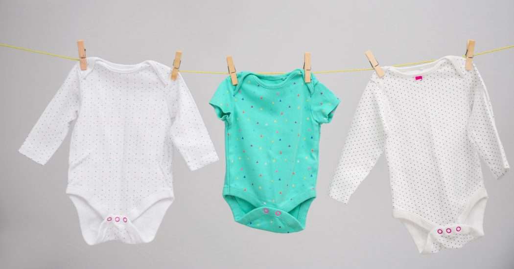 baby clothes hanging to dry. How to wash baby clothes?