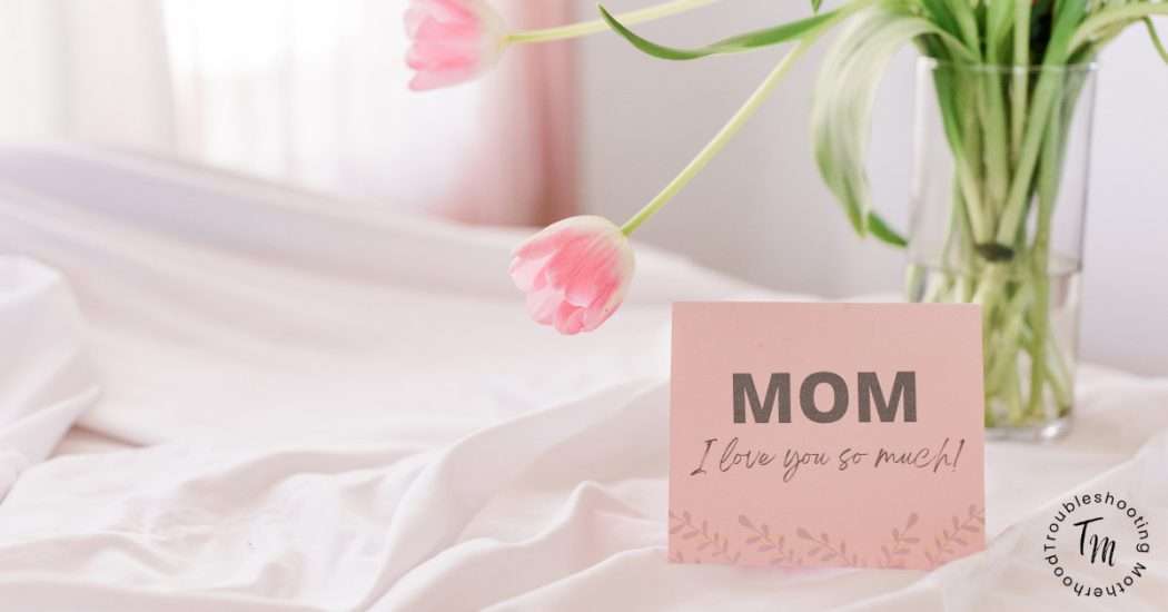 Mother's Day Gifts Ideas. Image of pink tulips and card that reads "Mom I love you so much." mother's day gifts for mom