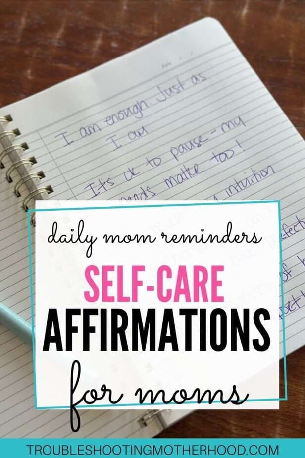 Open notebook with handwritten self-affirmations for moms, including “I am enough” and “It’s okay to pause,” great for daily reminders and positive affirmation quotes.