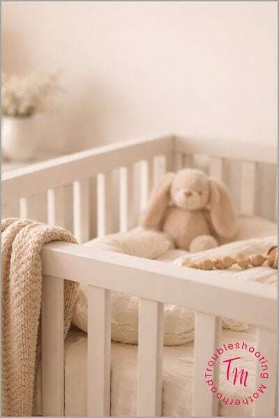 Minimal nursery corner in soft neutral tones with a crib and cozy textures, creating a calm backdrop for baby name inspiration