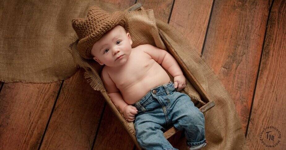 Southern Baby Boy Names. Image of baby boy in a crotchet cowboy hat. 