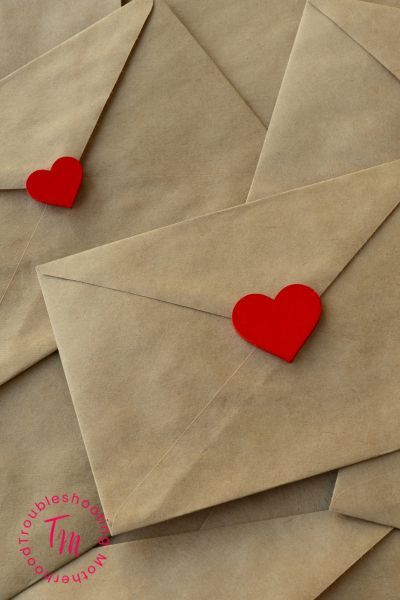 What to Write on Valentine's For Kids. Image of brown envelopes, sealed with heart sticker.